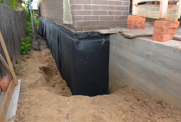 SJ Waterproofing Pros technician performing targeted Waterproofing assessment in Battle Creek, MI
